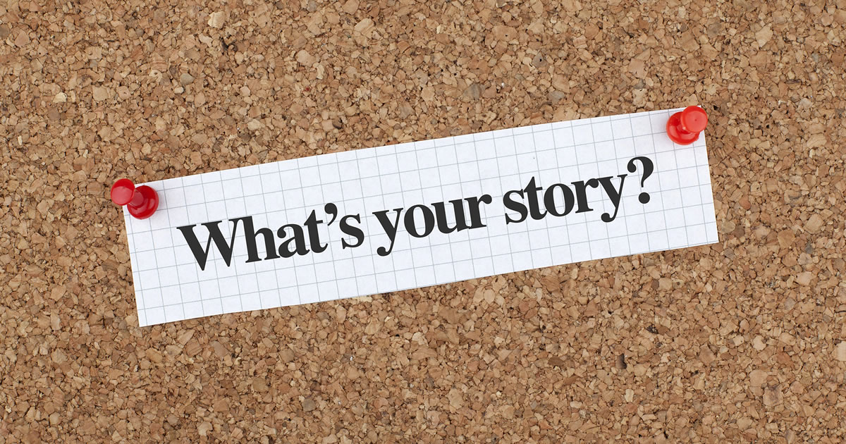 Cork board with paper showing the question What's Your Story pinned to it