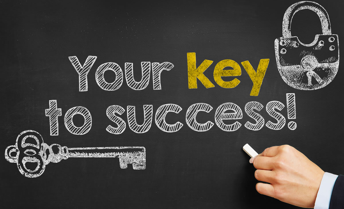 Handwritten Your Key to Success with hand drawn key and lock images on a chalkboard
