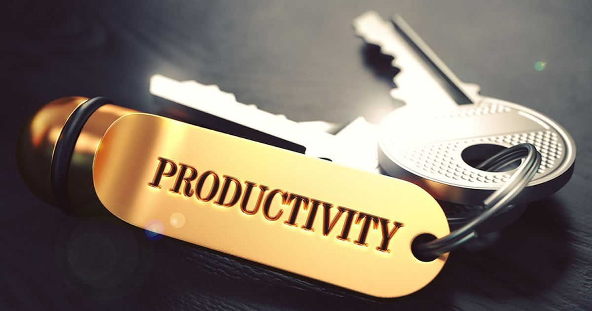 Keys on a gold keychain that says Productivity