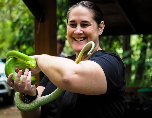 Photo of copywriter Rae Brent holding a snake