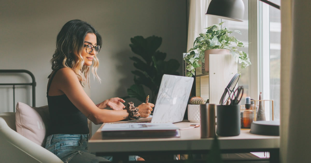 Young woman working out of her home office