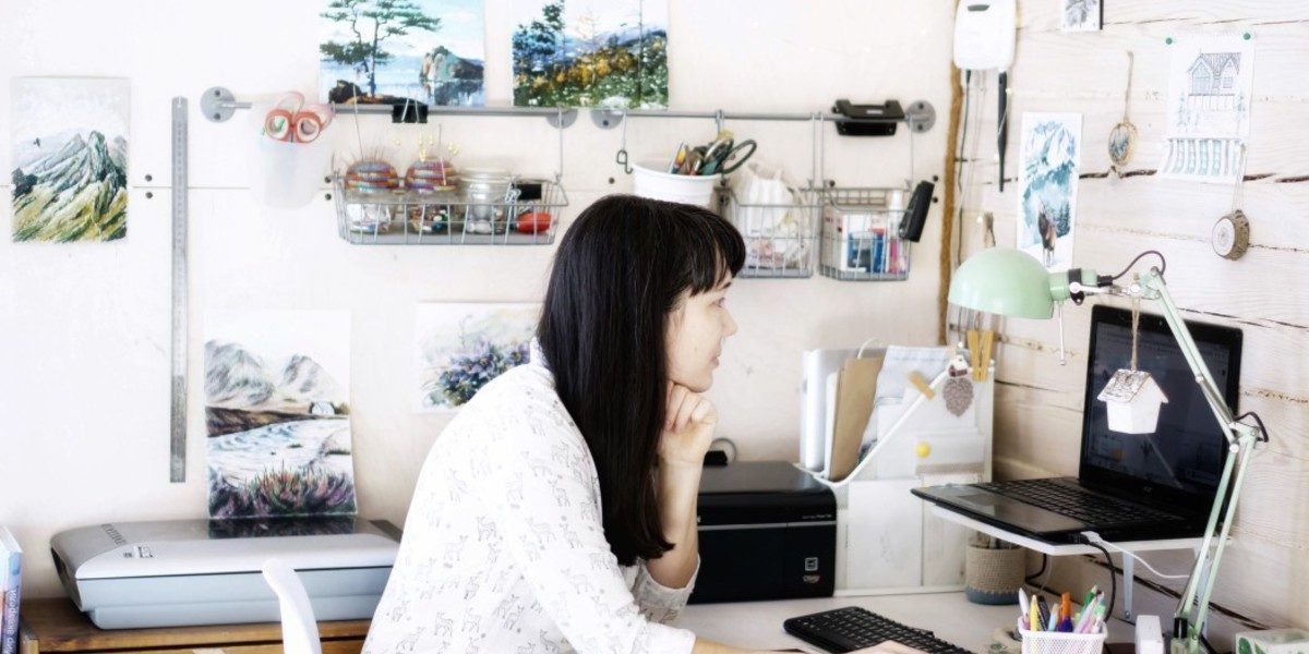 Young woman typing on keyboard