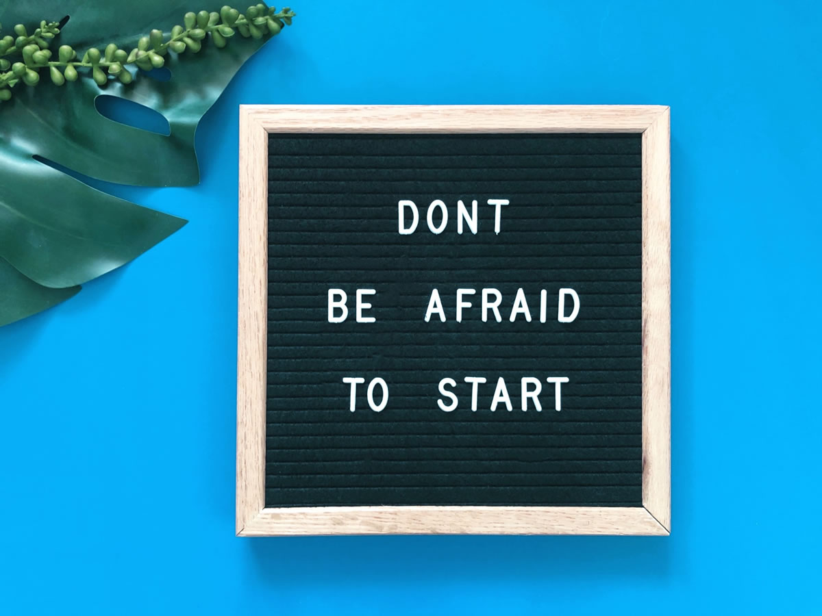 A sign that says, don't be afraid to start