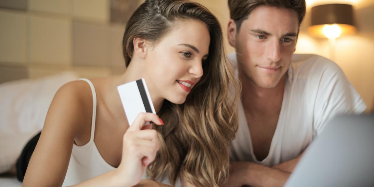 cheerful couple making purchases online