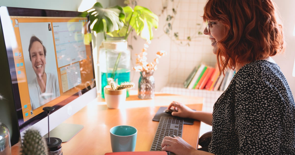 Women writer having a mentoring video call on a desktop computer