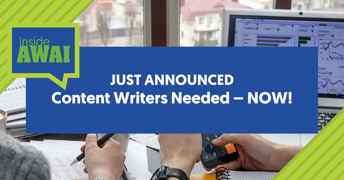 As palavras Inside AWAI Just Announced Content Writers Needed Now em uma caixa azul em cima de uma foto das mãos de dois colegas trabalhando em uma mesa com papelada, telefone celular e laptop