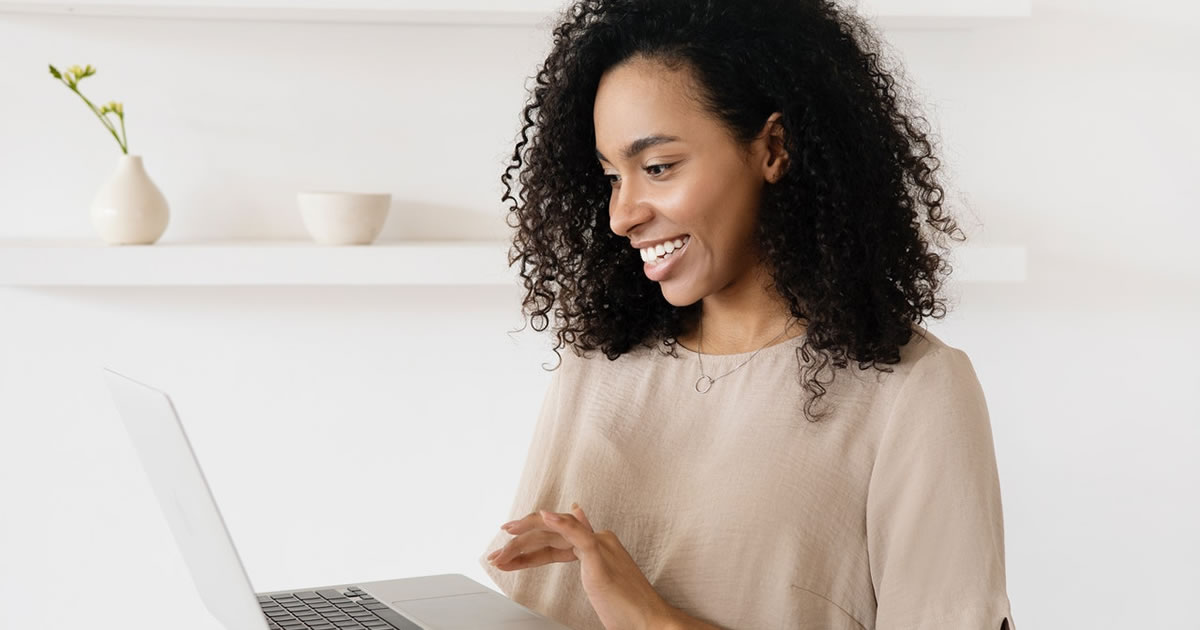 Woman writer looking at event macbook air