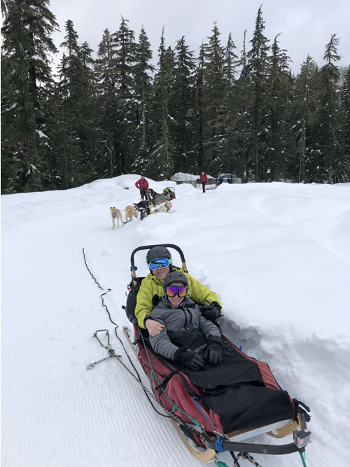 Writer Candice Lazar and her husband dog sledding in Whistler, British Columbia