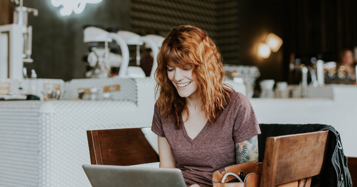 Woman typing on a laptop