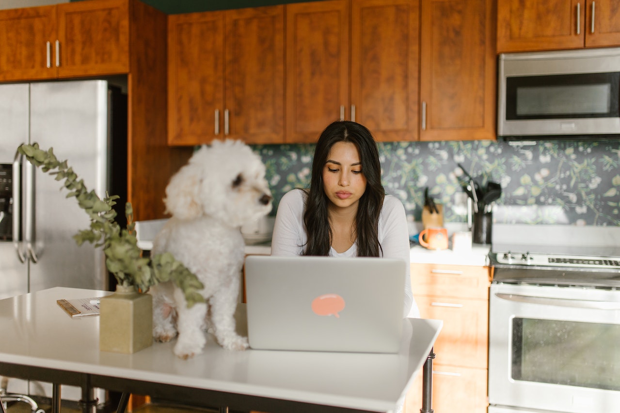 Woman typing on a laptop