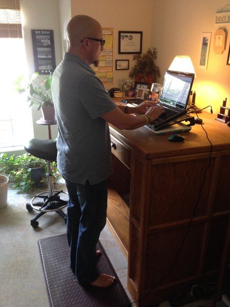 Writer Eddie Stephens creating copy at his a standing desk