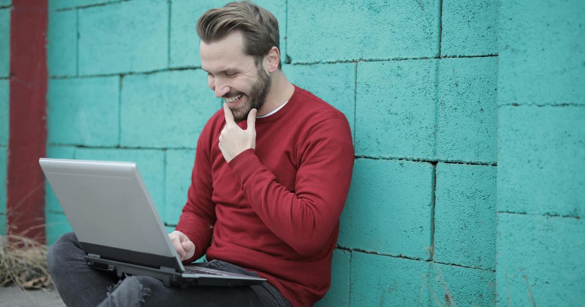 Writer sitting outside with laptop