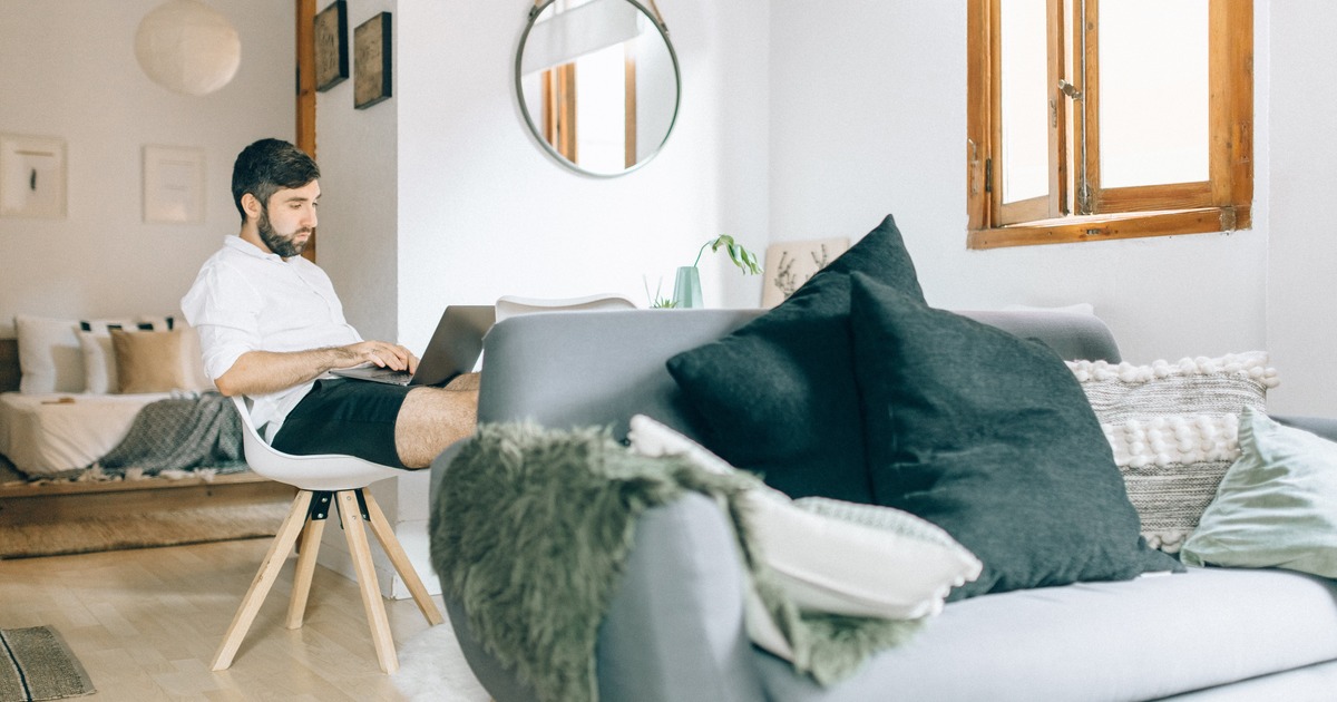 writer typing on a laptop