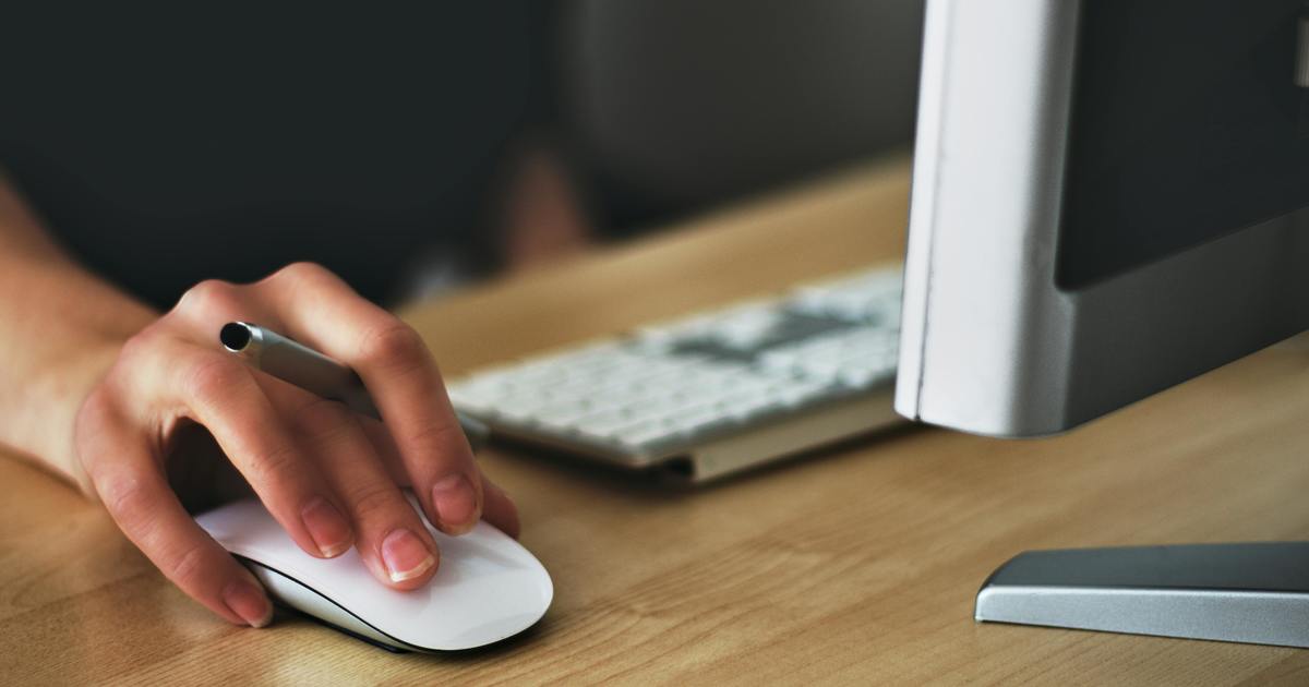 Writer typing on a laptop