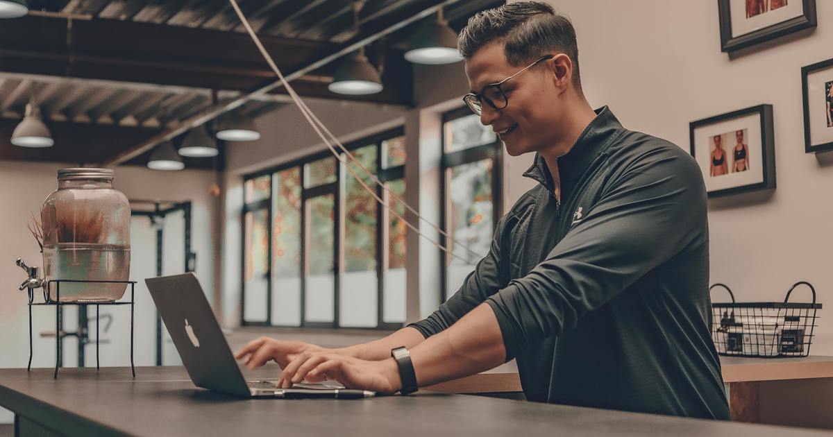 Writer typing on a laptop