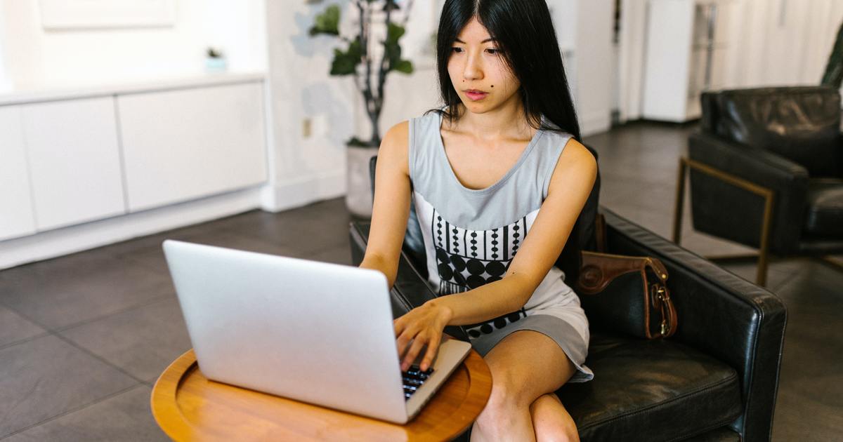 Writer sitting at desk with laptop