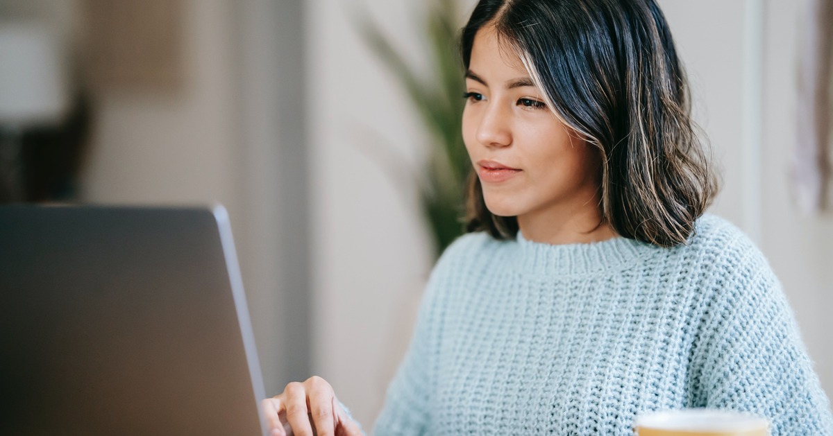 Writer typing on laptop