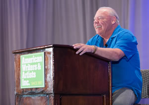 Clayton Makepeace at a podium speaking at Bootcamp