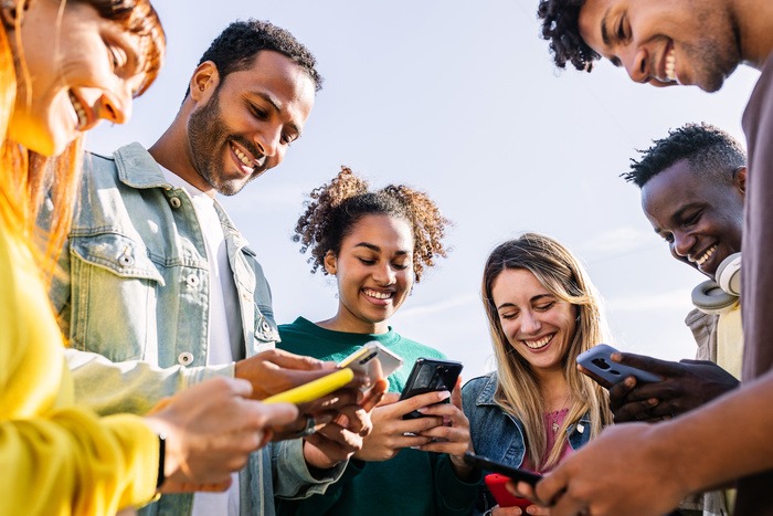 Group of young people on cell phones