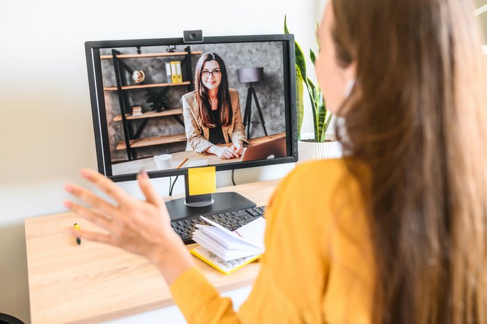 Two women talking over video conferencing