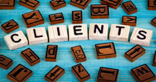 Wooden alphabet tiles spelling the word Clients