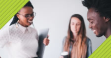 Smiling coworkers writing in notepad