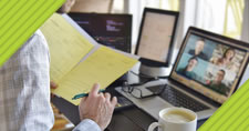 Office worker taking notes on a video call