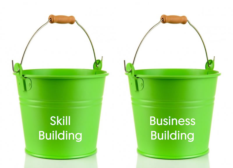 Image showing two green buckets, labeled skill-building and business-building