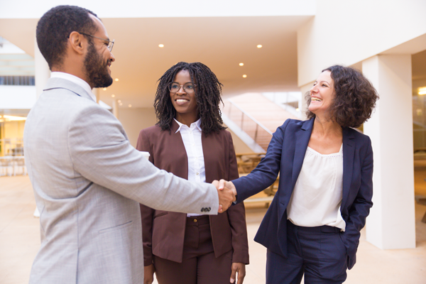 Three copywriters meeting at a networking event