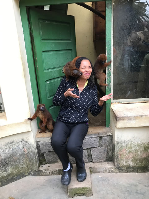 Carline getting licked by lemurs in Madagascar
