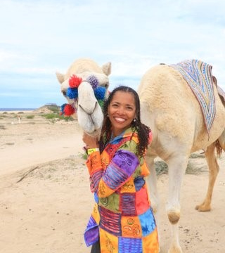 Carline Anglade-Cole posing with Camel