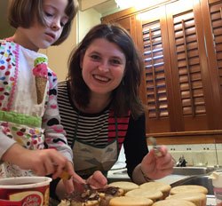 Andrea MacDonald baking with her young daughter