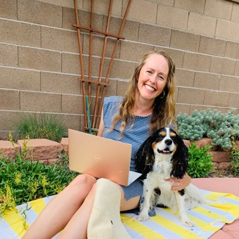 Mindy, pictured with her laptop and dog